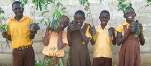 Children in Uganda with trees to be planted